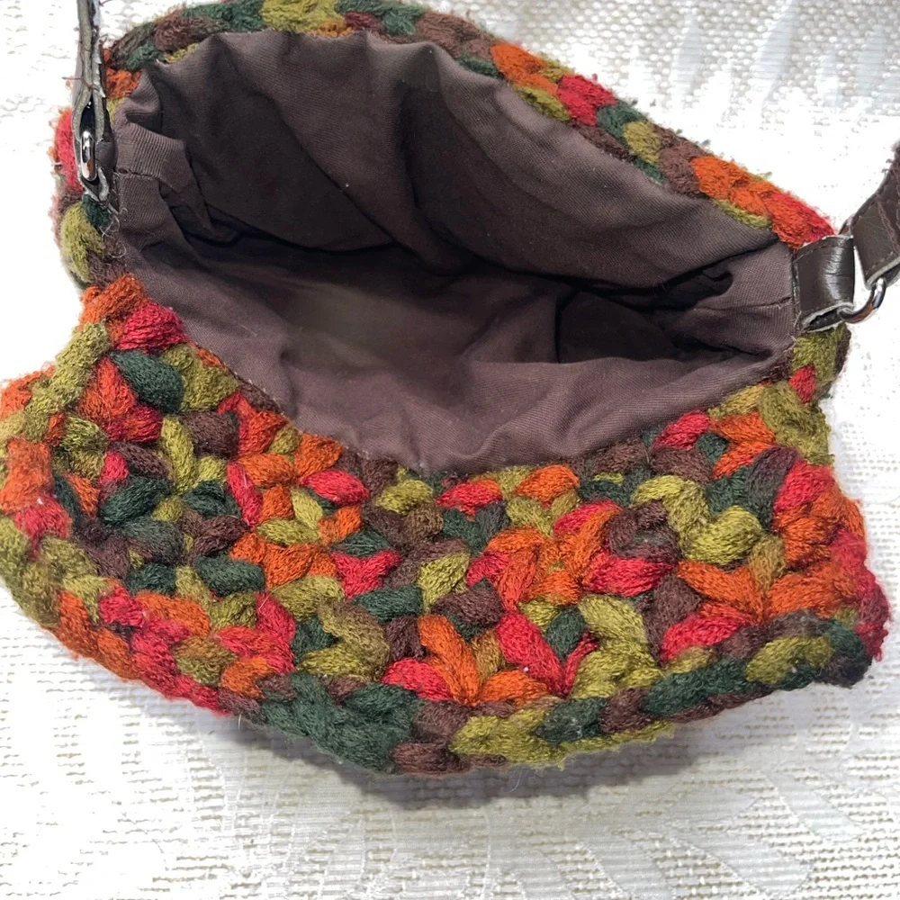 crossbody bag made with funky chunky, variegated yarn toggle closure